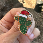 Load image into Gallery viewer, Christmas Cactus Enamel Pin with Santa Hat | Holiday Desert Plant Lapel Pin | Festive Cactus Badge | Stocking Stuffer Gift

